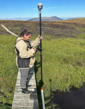 Researcher taking GPS measurements